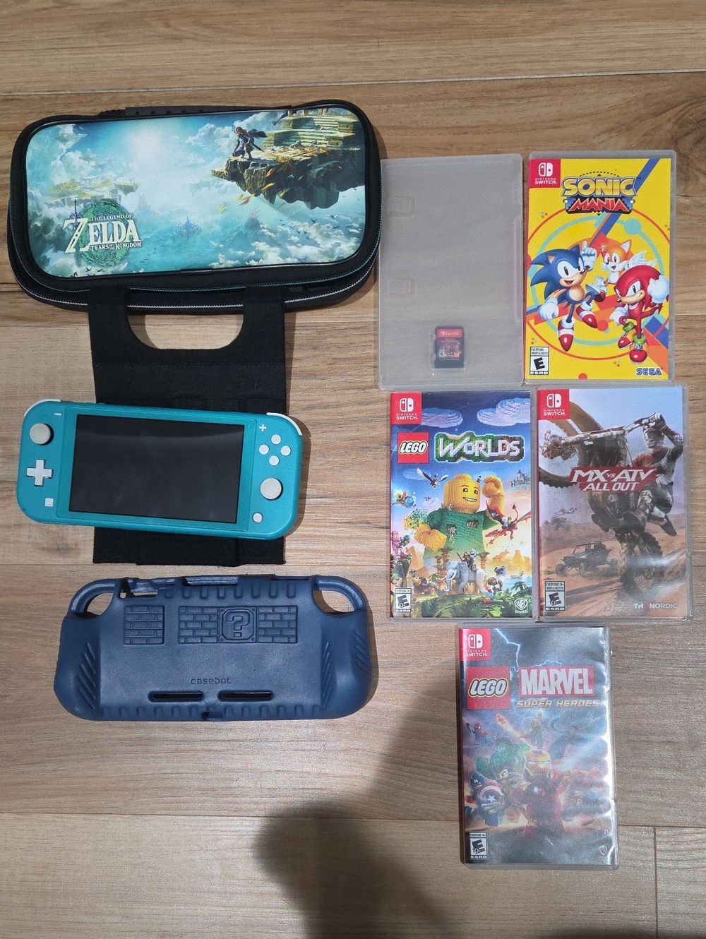Nintendo Switch Lite Turquoise with Zelda Carry Case and Game Bundle